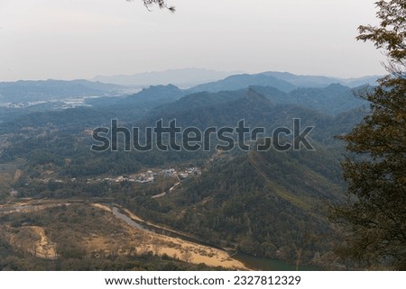 A beautiful picture taken at Wuyishan mountain in China. Nice view from the high viewpoint on th sunset valley. Vertical image with copy space
