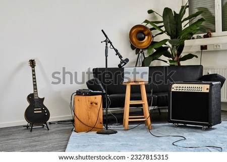 Home music studio environment with guitar Royalty-Free Stock Photo #2327815315