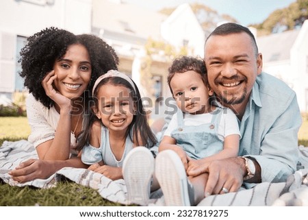 Portrait, blended family and parents on the lawn with their kids in the garden of their home together. Mother, father and children lying on the grass in the yard of their house for love or bonding Royalty-Free Stock Photo #2327819275