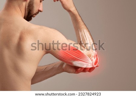 A Man's Grip on His Painful Elbow, human arm pain Royalty-Free Stock Photo #2327824923