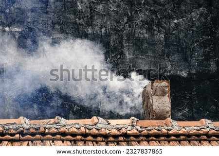 Smoking chimney in house with stove heating. Harmful emissions into atmosphere, poor air quality concept Royalty-Free Stock Photo #2327837865