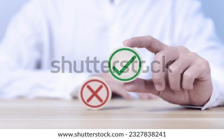 wood block showing right and wrong sign decision concept, vote and think yes or no Business options for difficult situations true and false symbol. select the right mark Royalty-Free Stock Photo #2327838241