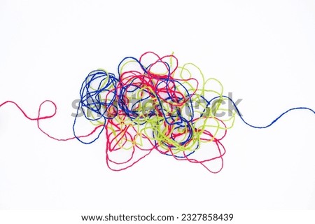 Tangled ropes on white background, three colorful ropes in confusion, psychotherapy, or difficult problem that hard to resolve Royalty-Free Stock Photo #2327858439