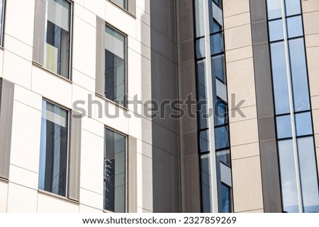 Vertical line glass and metal panels facade. Details of architecture