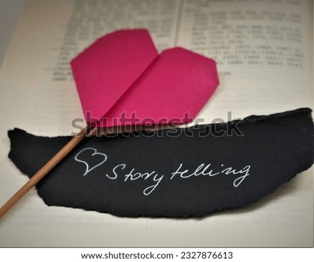 Love storytelling  - open book and heart 