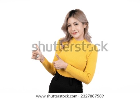 Smiling happy asian woman with her finger pointing isolated on white background.