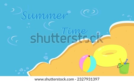 Summer time. Beach. Swimming circle, sand play set, beach ball.
