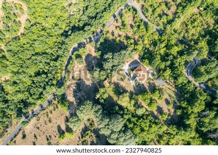 Meandering serpentine road in the mountain. Aerial view. Copter, drone view