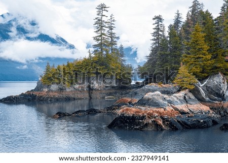 View of island from Kenai Fjords National Park Cruise tour in Alaska, USA. Royalty-Free Stock Photo #2327949141