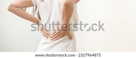 Pain body muscles stiff problem, asian young woman, girl painful with back, neck ache from work hand holding massaging rubbing shoulder hurt, sore on white background. Health care and medicine concept Royalty-Free Stock Photo #2327964875