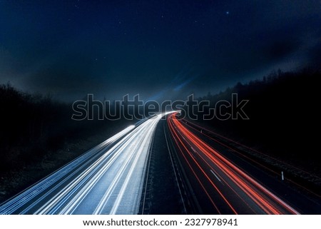 A picture of a busy road with a little time lapse 
