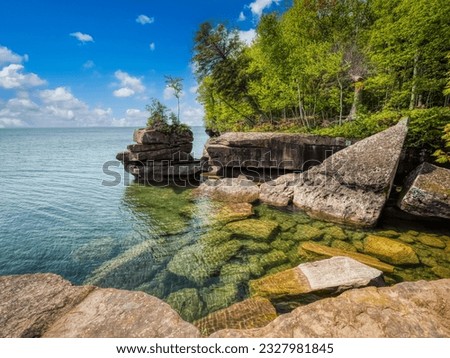 Rocky coastline of Lake Superior in Big Bay State Park in La Pointe on Madeline Island in the Apostle Islands National Lakeshore in Wisconsin USA Royalty-Free Stock Photo #2327981845