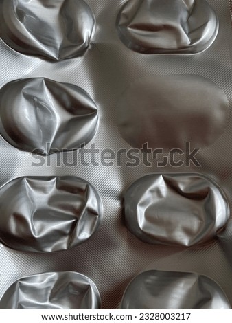 Close-up of pill packaging is seeing as a background