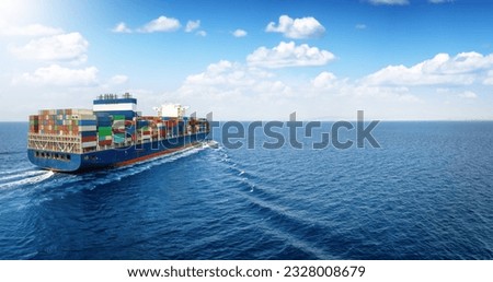 Panoramic view of a large cargo ship carrying containers for import and export, business logistic and transportation in open sea with copy space 