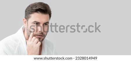 Banner of man with perfect skin touch face after shaving. Skin care healthcare cosmetic procedures concept. Close up man looking in mirror, sensitive skin, cosmetology treatment. Skin care. Royalty-Free Stock Photo #2328014949