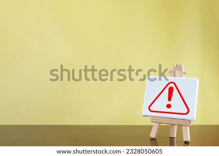 Safety Precautions,Sign,Cautionary Warning,safety, hazard,caution, danger concept.,Attention-Grabbing Sign of Danger and Safety icon on white stand board over yellow background with freespace.