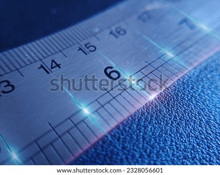The number six or 6. Macro photography of stainless steel ruler image with laser light style