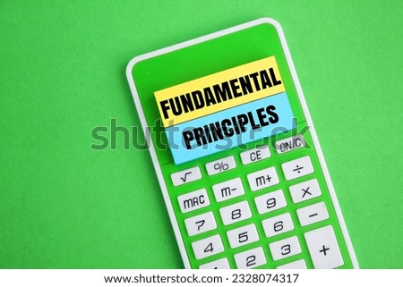 calculator and colored paper with the word Fundamental Principles. business concept