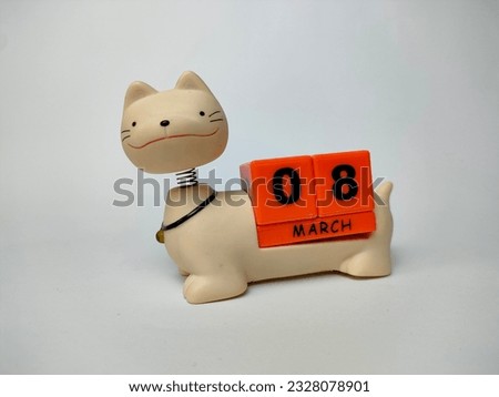a unique march teddy cat calendar with blocks with the date and month written on it, on a white background