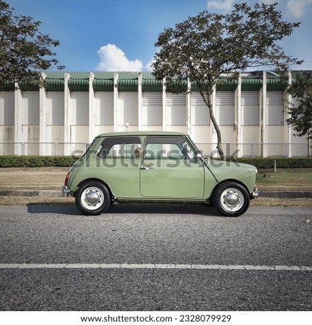 mini car, classic car, road trip, tree, green Royalty-Free Stock Photo #2328079929