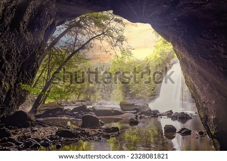 Waterfall in tropical forest at Khao Yai National Park, Thailand. Waterfall view from inside the cave. Amazing of Haew Suwat Waterfall Unseen Khao Yai National Park, Thailand. Traveling ecotourism.

