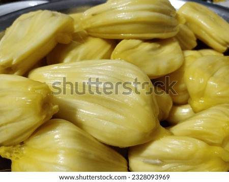 Most delicious ripe jackfruit bulbs ready to serve. Tropical fruit that is enriched with multi vitamin and mineral. Food background to print on magazine cover, restaurant menu, dining table cloth etc