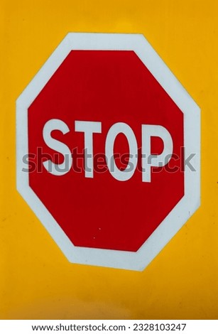 Yellow Background with STOP Sign