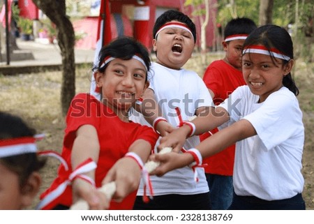 Indonesian kids celebrate Indonesia independence day with outdoor contest Royalty-Free Stock Photo #2328138769
