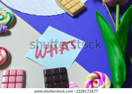 English vocabulary "WHAT" on the theme of sweets, chocolate bars, lollipops, candy as a background