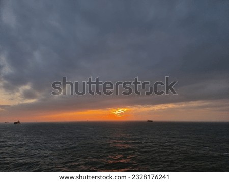 a picture of the red sunset and the beautiful sea