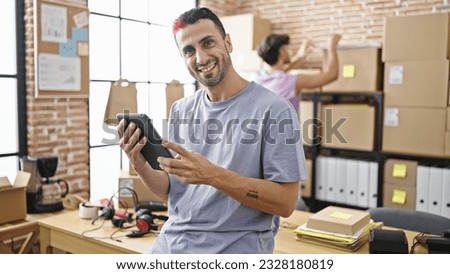 Two men ecommerce business workers using touchpad working at office