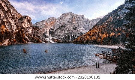 Stunning nature landscape. Scenic image in Sunny day of the Braies Lake, Pragser Wildsee in Dolomites mountains, Italy. Impressive Lago di Braies. Iconic location for landscape photographers