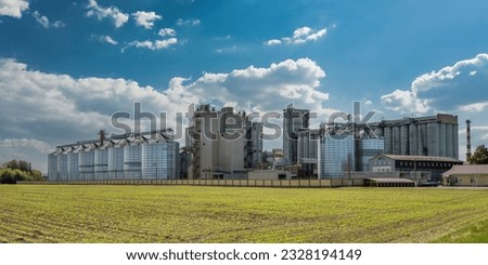 agro silos on agro-industrial complex and grain drying and seeds cleaning line. Royalty-Free Stock Photo #2328194149