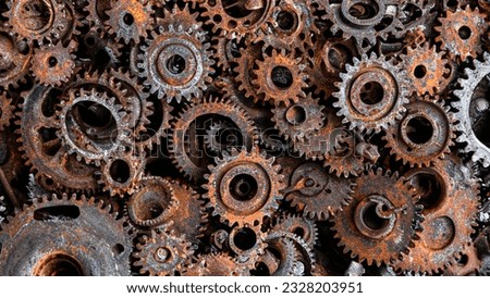 many old rusty metal gears or machine parts