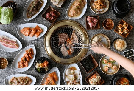 Korean BBQ with lots of food Royalty-Free Stock Photo #2328212817