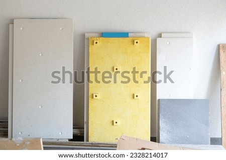 Plates for sound insulation of walls in the room. Drywall for wall mounting. Soundproof panel system Royalty-Free Stock Photo #2328214017