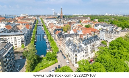 Beautiful aerial view of Copenhagen skyline from above, Nyhavn historical pier port and canal with color buildings and boats in the old town of Copenhagen, Denmark Royalty-Free Stock Photo #2328239109