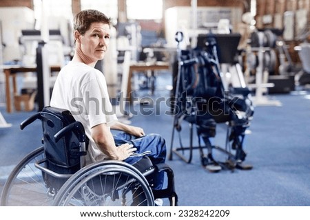 Man in wheelchair waiting for physical therapy Royalty-Free Stock Photo #2328242209