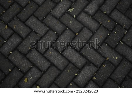 a photo of a paving street with a chevron pattern and forms a beautiful pattern and has a minimalist impression. can be used as a background