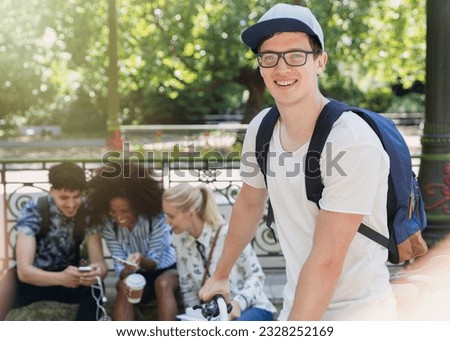 Portrait smiling man with eyeglasses in park