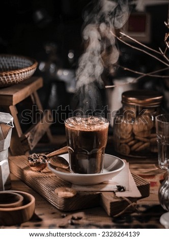 Hot coffee on the table. Darkmood stilllfie photography. selective focus