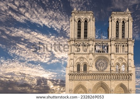 Notre Dame de Paris (against the background of sky with clouds), also known as Notre Dame Cathedral or simply Notre Dame, is a Gothic, Roman Catholic cathedral of Paris, France