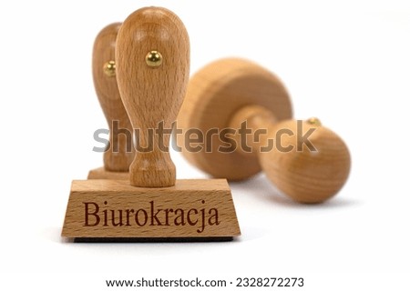Wooden stamp with the imprint "Biurokracja", translation "Bureaucracy"