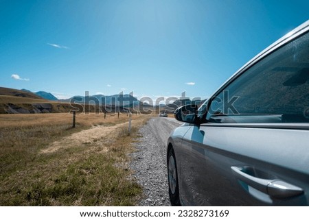 Self-driving tour in New Zealand. Enchanting views along the picturesque roadsides of New Zealand, showcasing the beauty of the landscapes that await your journey. State Highway 73 route, South Island Royalty-Free Stock Photo #2328273169