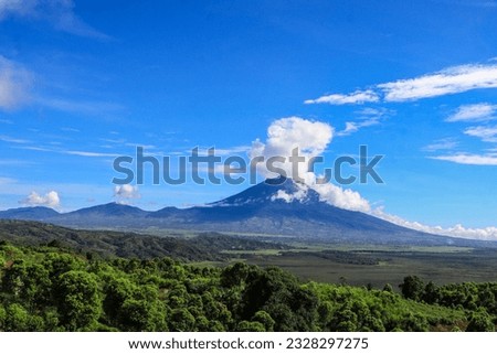 Mount Kerinci (Gunung Kerinci) is the highest mountain in Sumatra, the highest volcano and the highest peak in Indonesia with an altitude of 3805 masl, located in the Kerinci Seblat National Park area Royalty-Free Stock Photo #2328297275
