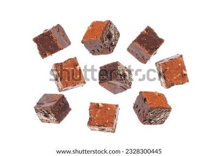 Mini chocolate brownies isolated on white background in different angles.  Royalty-Free Stock Photo #2328300445