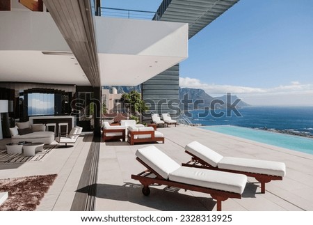 Modern patio and infinity pool overlooking ocean
