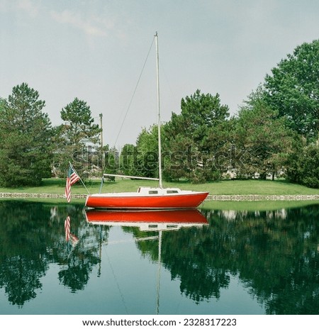 A boat on the water with an American flag (shot on medium format film.)