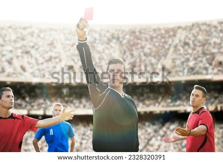 Referee flashing red card in soccer game