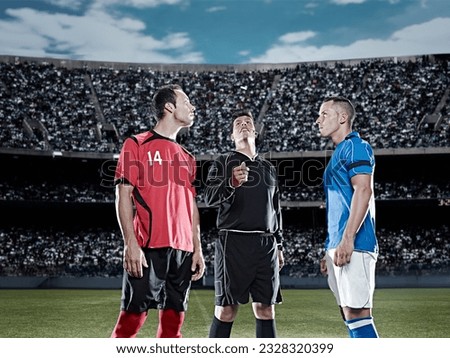 Referee tossing coin in soccer game Royalty-Free Stock Photo #2328320399
